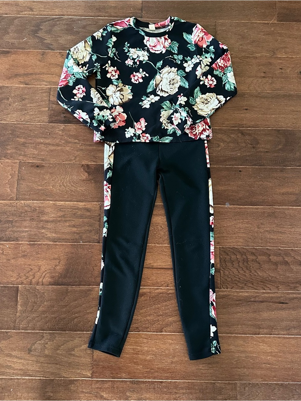 Girl’s black and floral print athletic set